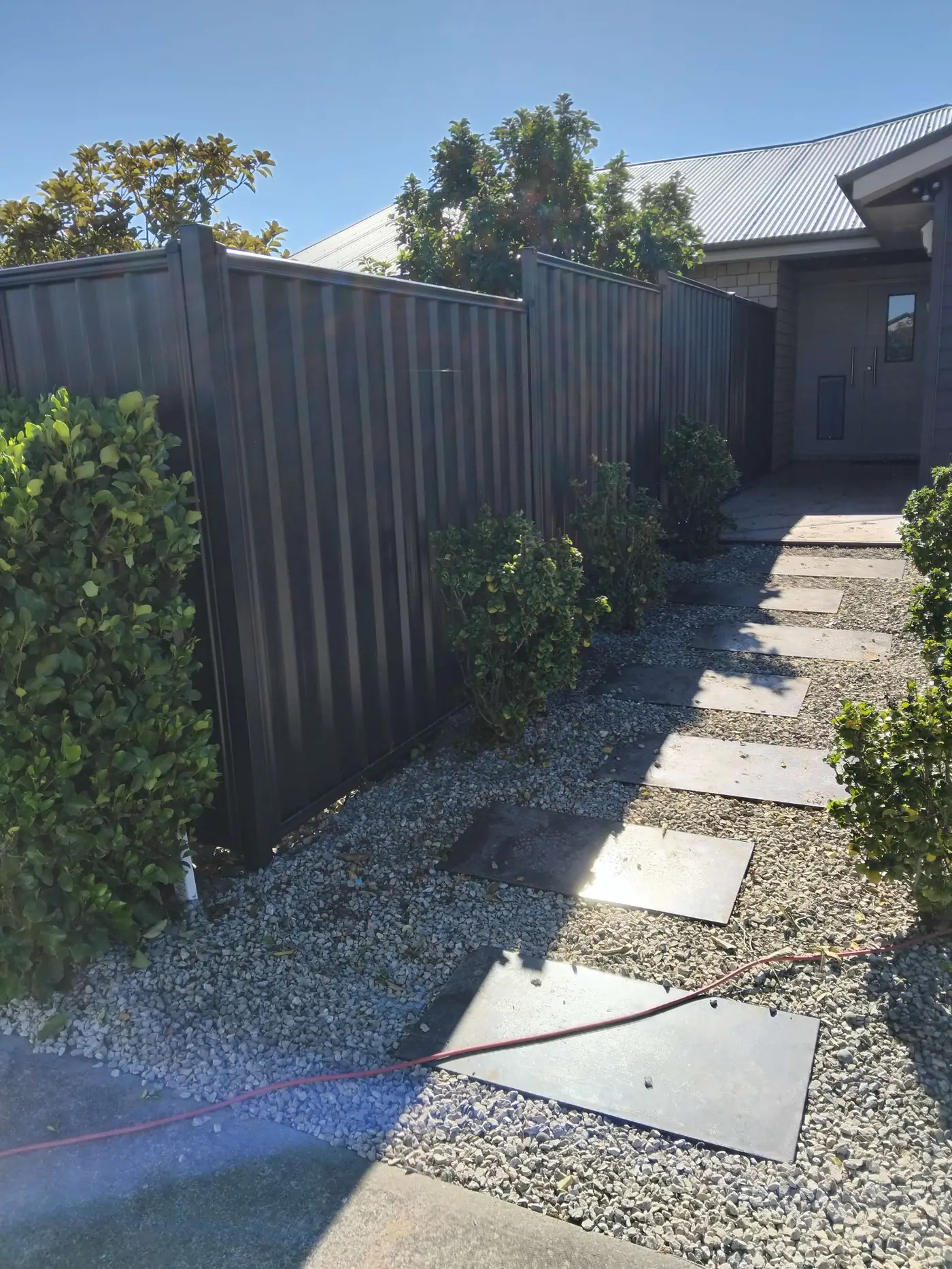 Neighbour-friendly double-sided timber fence in Sockburn, Christchurch