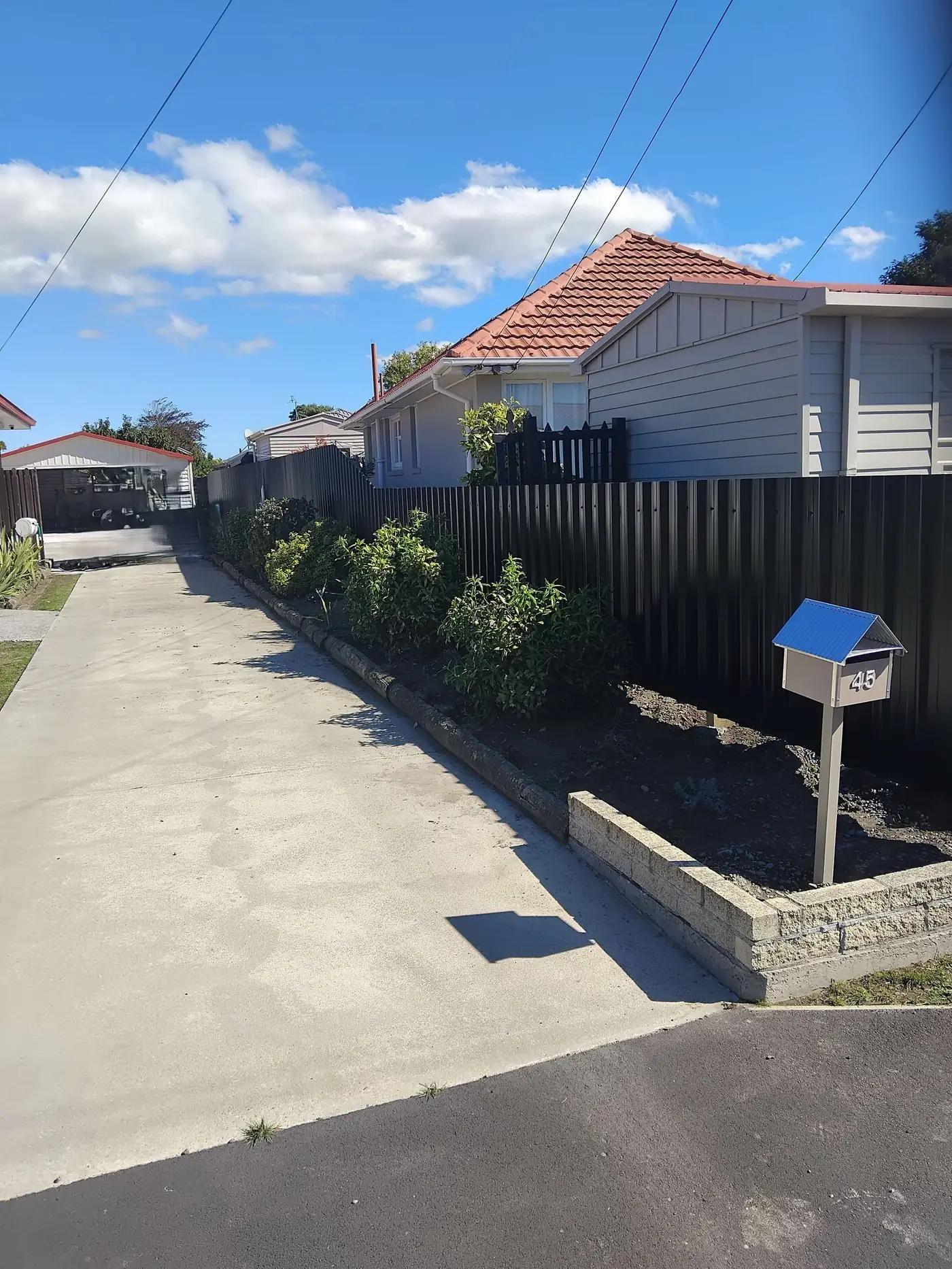 Black Colourbond steel privacy fencing built in Christchurch